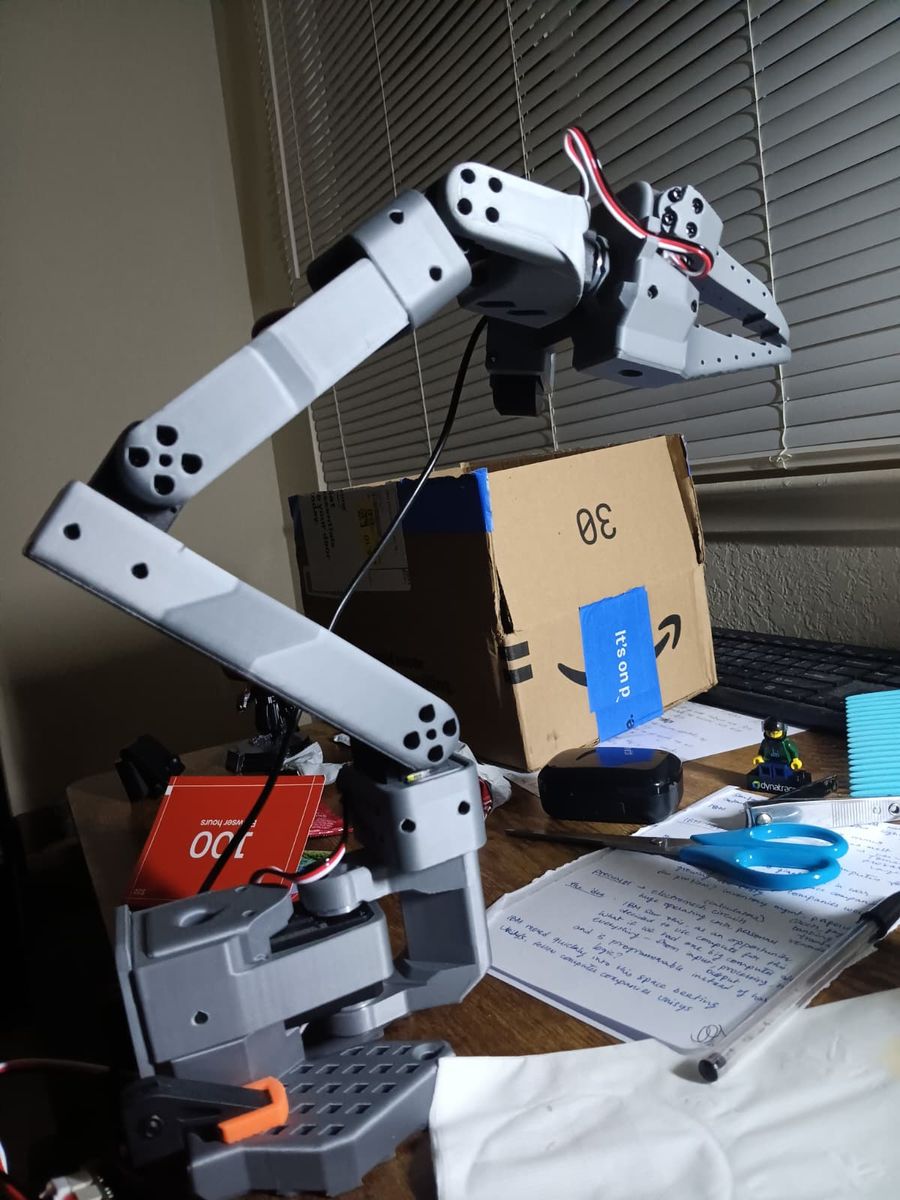 Close-up of the SO-101 robot arm on the desk